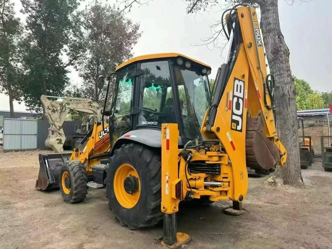 Excavadora de retroexcavadora JCB 3CX usada con cubo dividido y brazo extendido